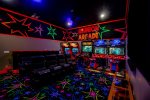Play all day in the super fun black-light arcade with connected racing snow cross, race grid, Terminator and basketball arcades